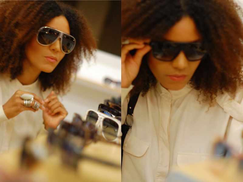 Ndoema The Global Girl shopping for vintage sunglasses at A Current Affair. 