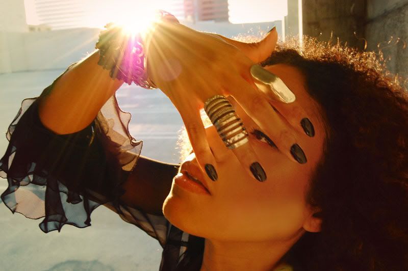 Ndoema wears AllSaints leather leggings, L.A.M.A.B platform sandals and vintage silver jewelry.