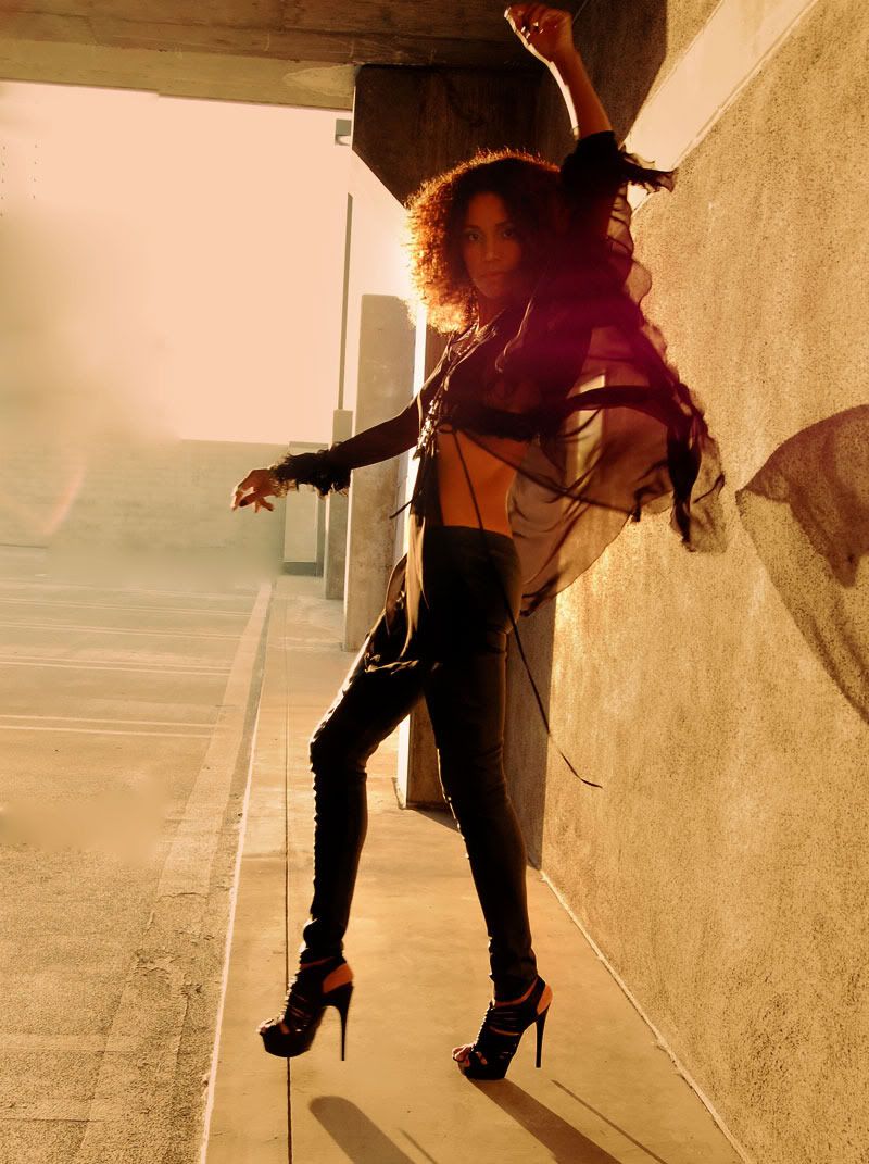 Ndoema wears AllSaints leather leggings, L.A.M.A.B platform sandals and vintage silver jewelry.