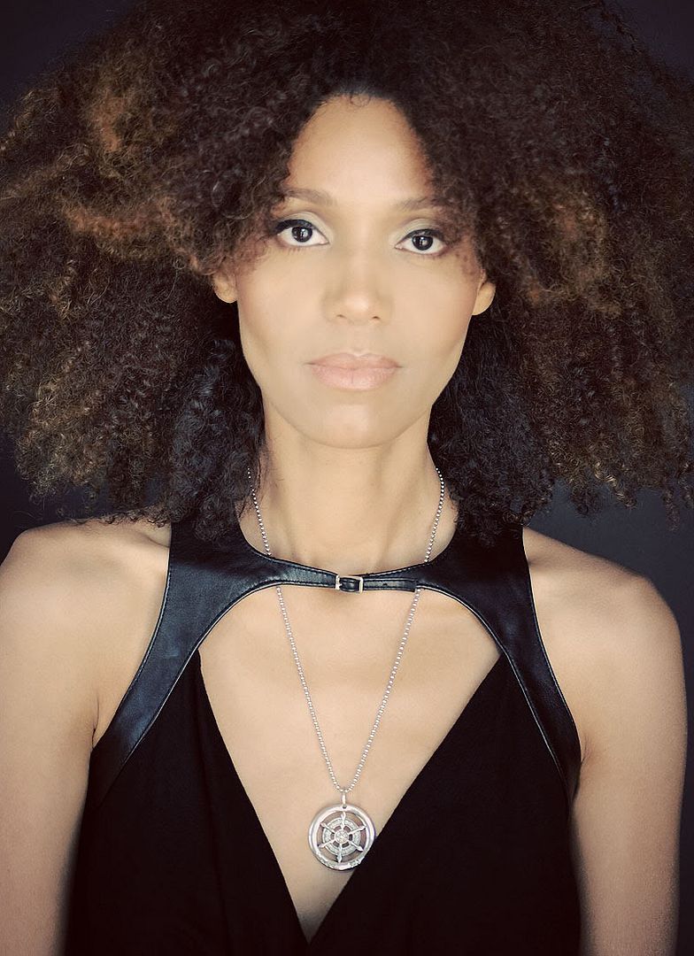 Ndoema wears a leather harness top from Plein Sud and Silver Sterling Pendant from Samsara Workshop