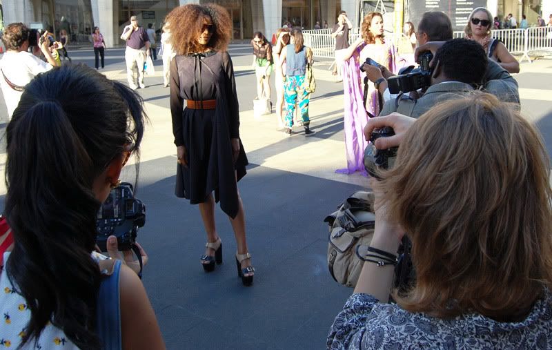 Ndoema The Global Girl wears a dress by Mexican designer Cesar Arrellanes, belt by Acne and shoes by Report Signature during New York Fashion Week.