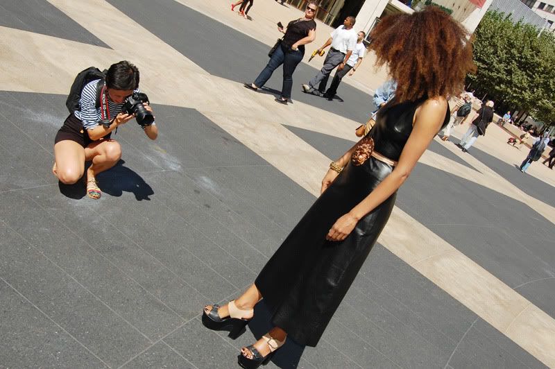 Ndoema The Global Girl arrives at the Lincoln Center during New York Fashion Week. Ndoema wears a black leather dress, ethnic belt, Report Signature shoes and Chloe Sunglasses