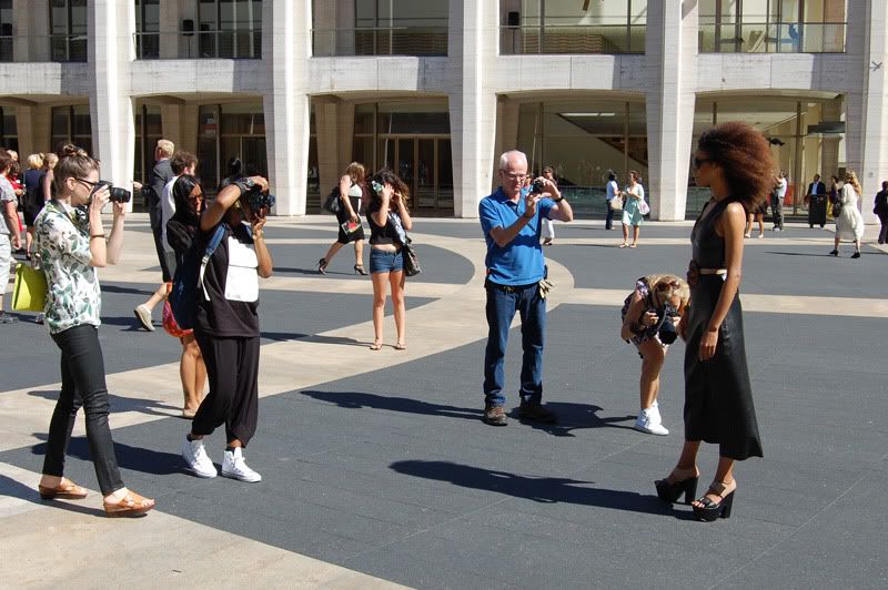 Ndoema The Global Girl arrives at the Lincoln Center during New York Fashion Week. Ndoema wears a black leather dress, ethnic belt, Report Signature shoes and Chloe Sunglasses