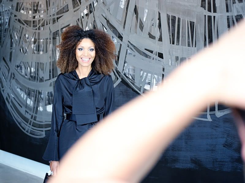 Ndoema arrives at Ace Gallery during Fashion Week wearing Gucci pointed-toe stilettos, a vintage trench-coat dress and vintage python clutch.