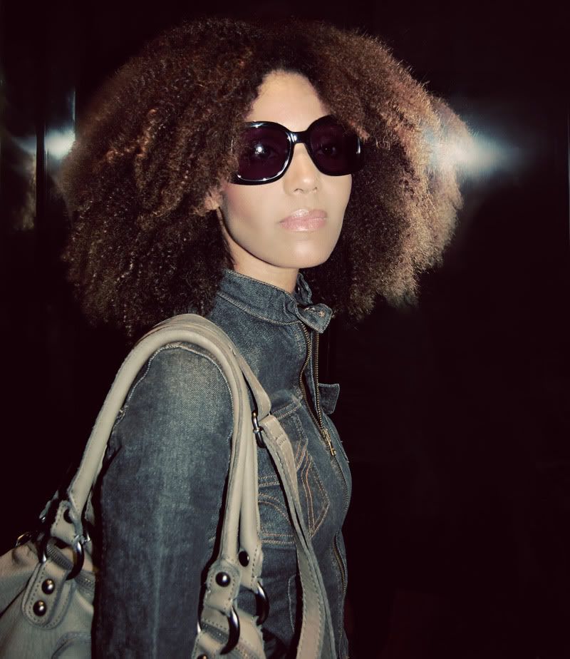 Ndoema wears Chloé sunglasses, Dolce and Gabbana cropped denim jacket, G-Star Raw skinny jeans and Linea Pelle leather bag.